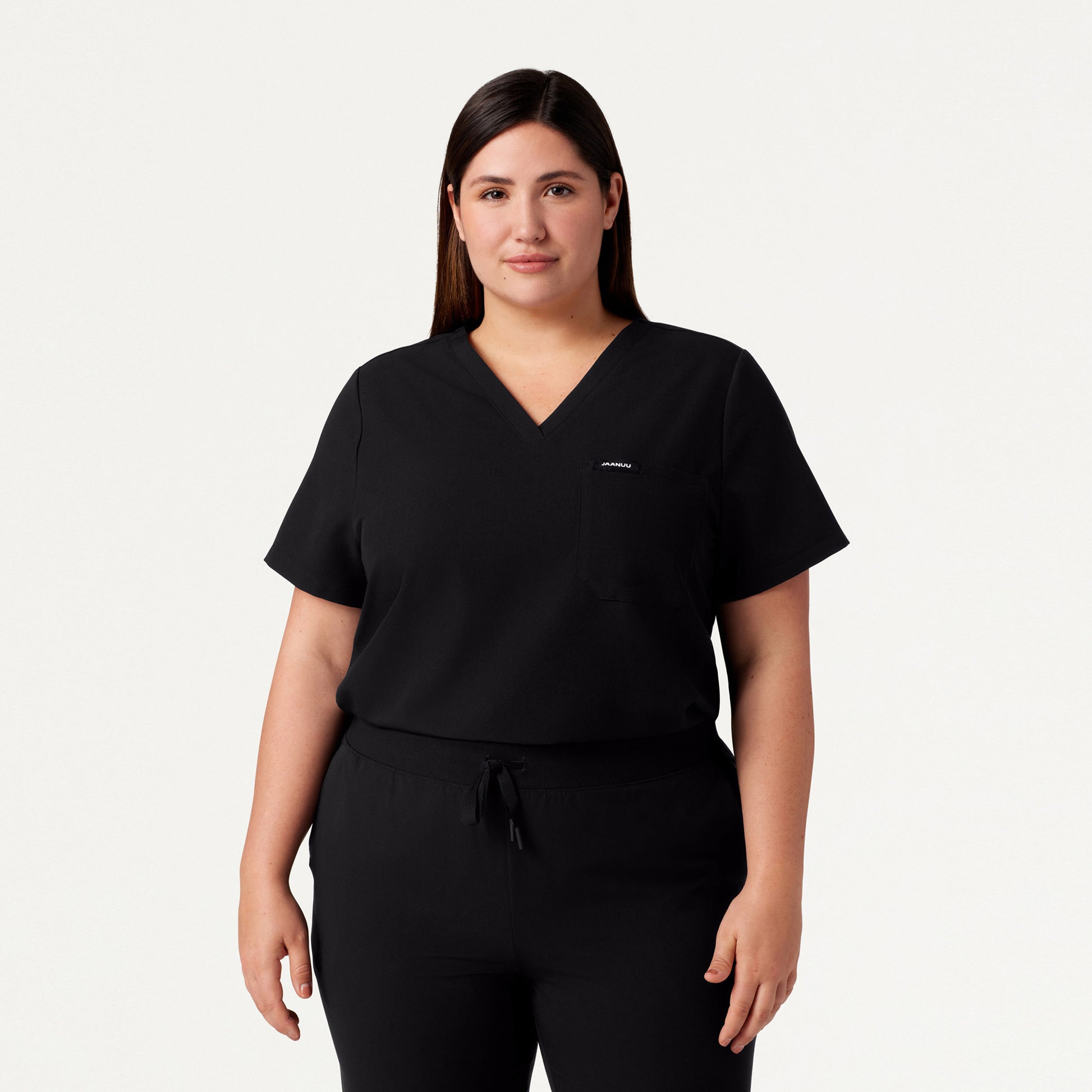 JAANUU Rhena Essential 1 pocket Scrub Top Black - Get Scrubbed