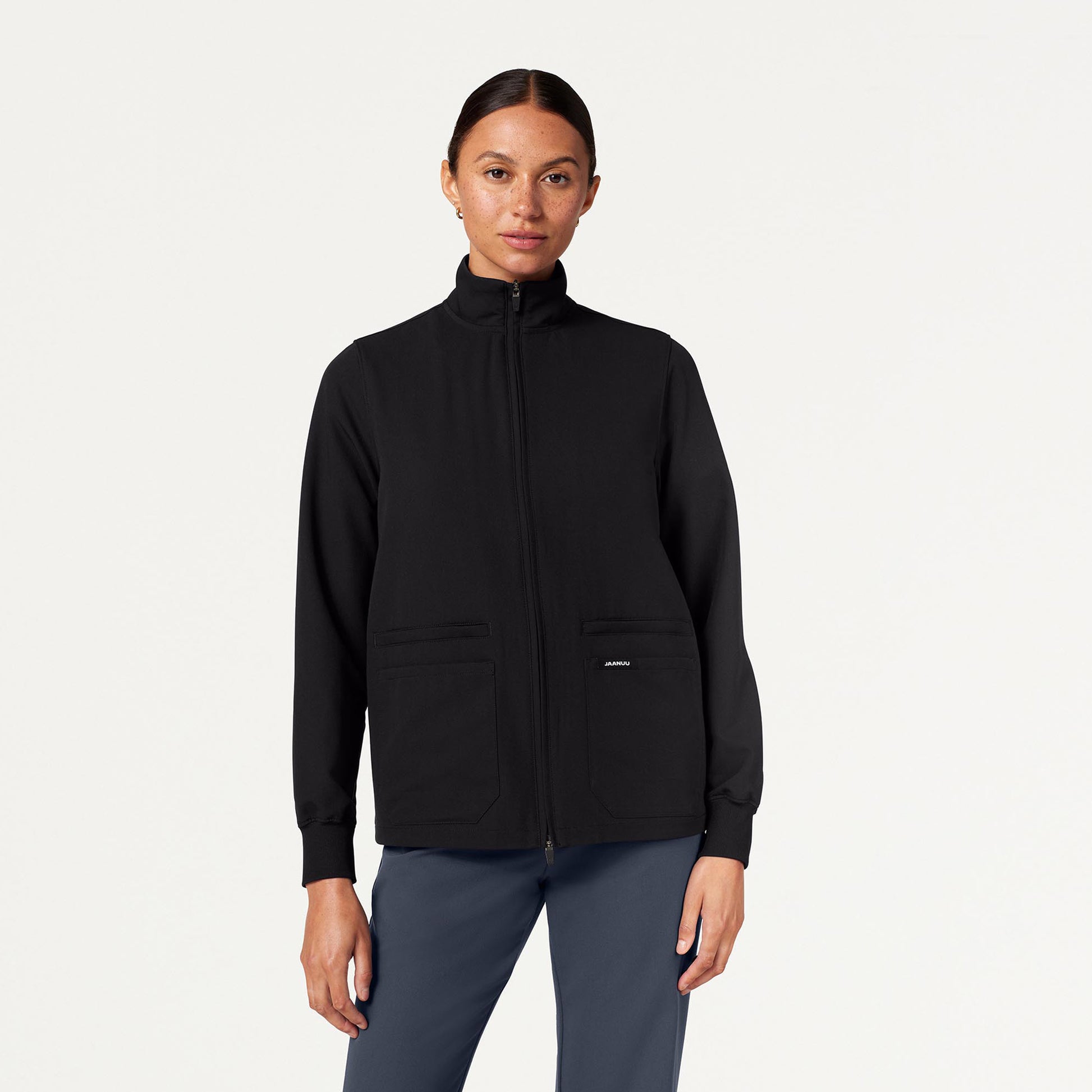 JAANUU Ceri Essential 6 - Pocket Scrub Jacket Black - Get Scrubbed