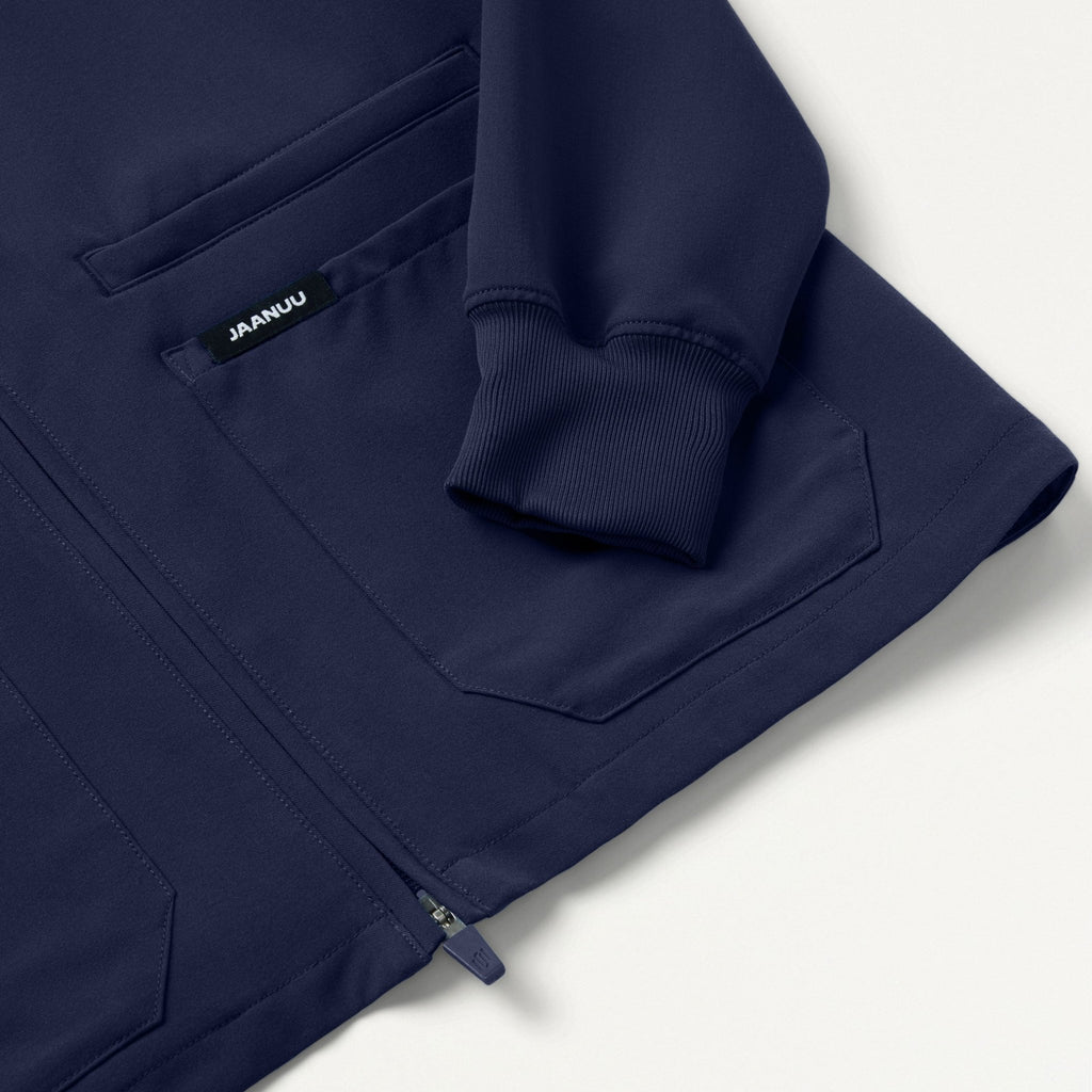 JAANUU Ceri Essential 6 - Pocket Scrub Jacket Midnight Navy - Get Scrubbed