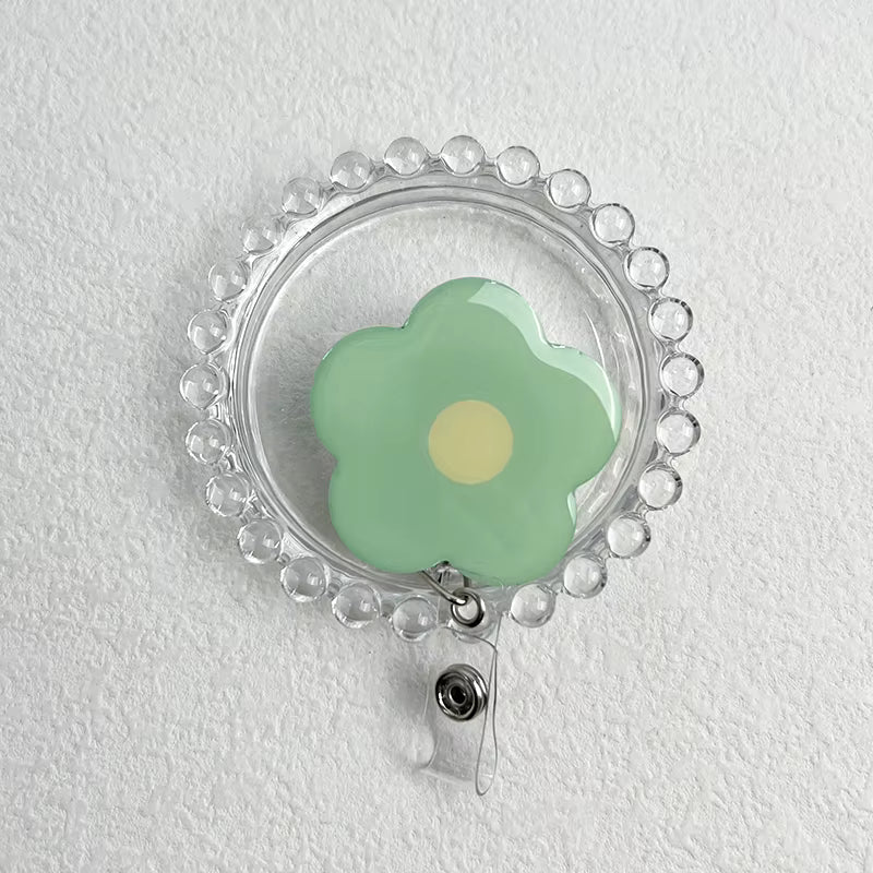 Daisy Retractable Badge Reel - Green with Yellow Centre