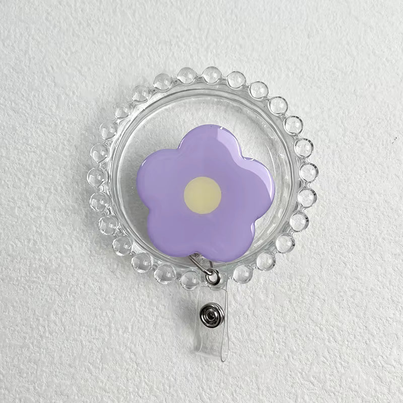 Daisy Retractable Badge Reel - Purple with Yellow Centre